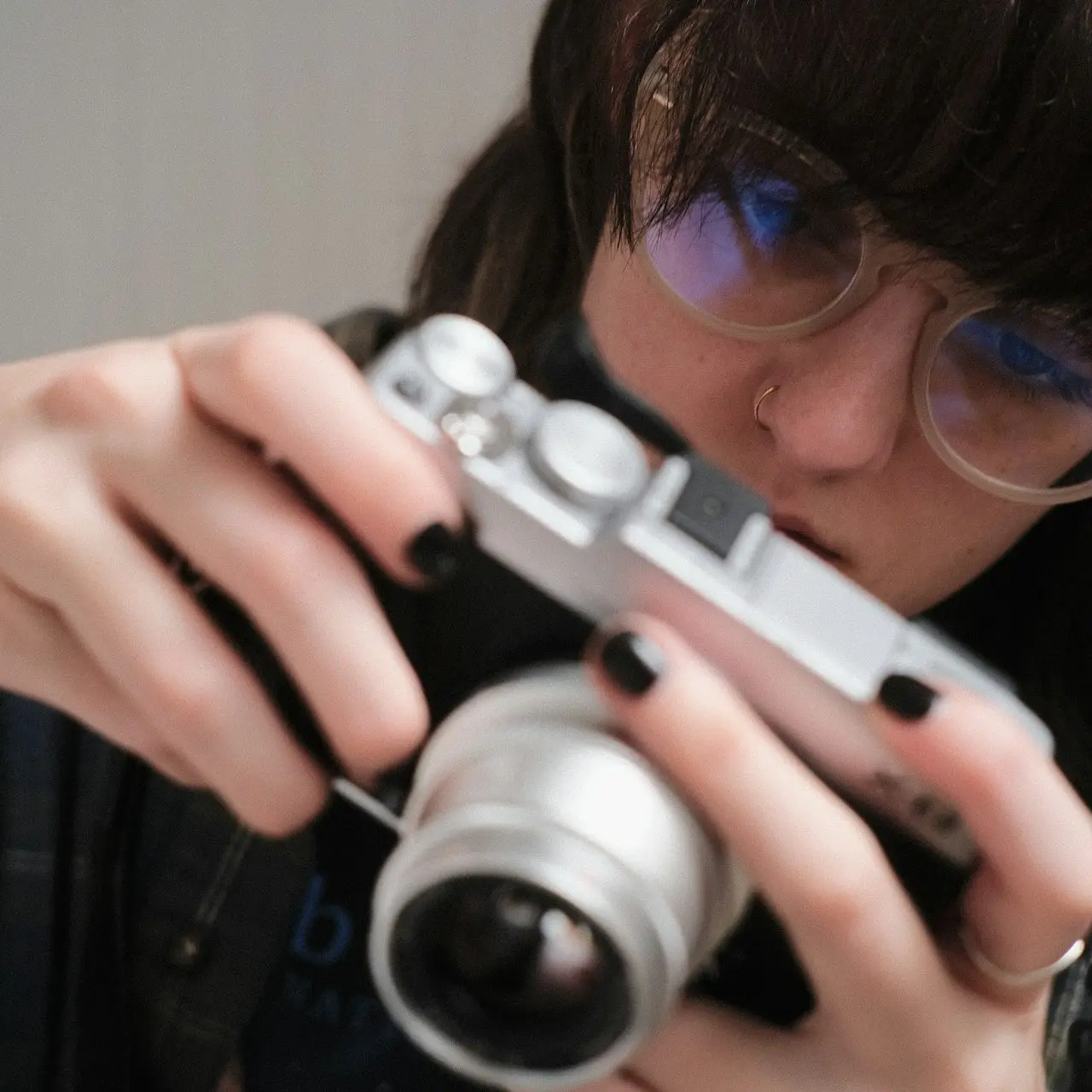 a woman taking a picture with a camera